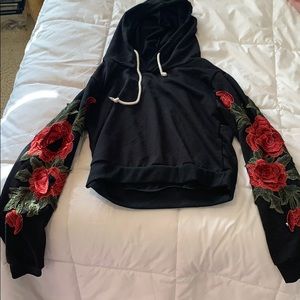 black hoodie with red rose sleeves